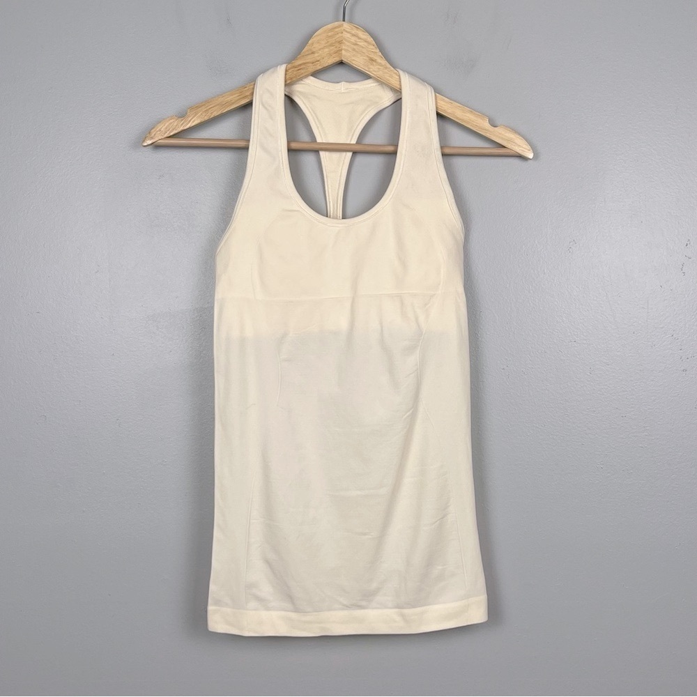 Lululemon ivory racerback fitted tank w/builtin shelf bra, size 4.